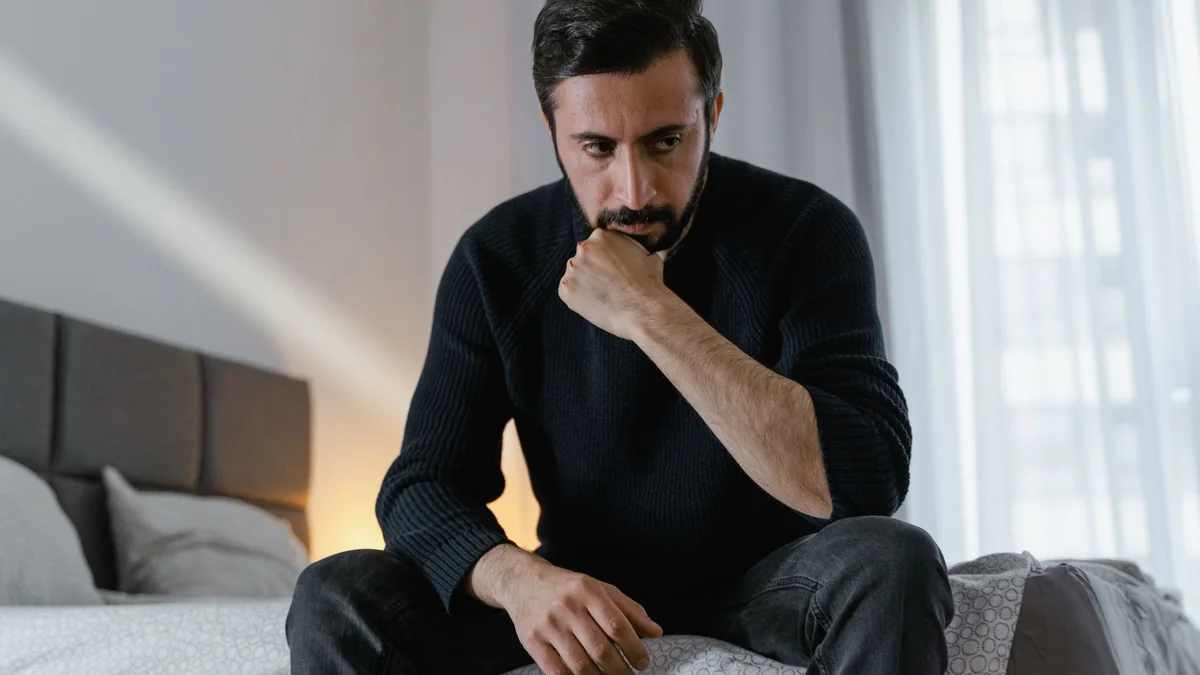 Thoughtful man considering a change in erection quality