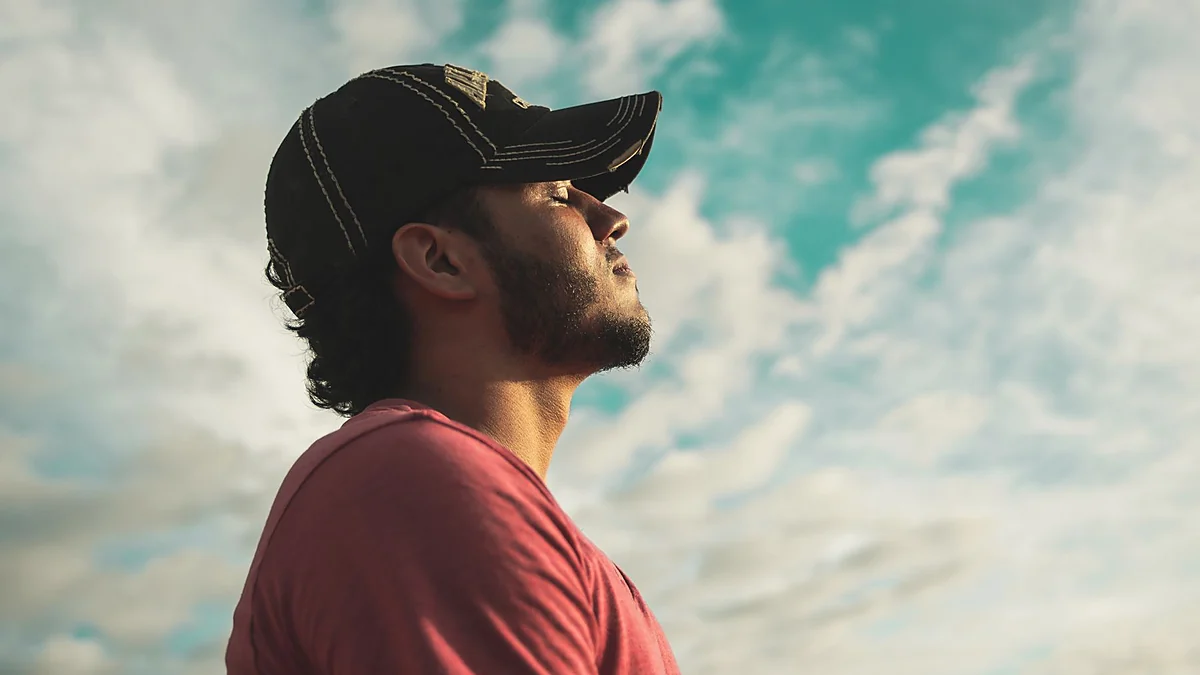 Man using controlled breathing for relaxation and body awareness
