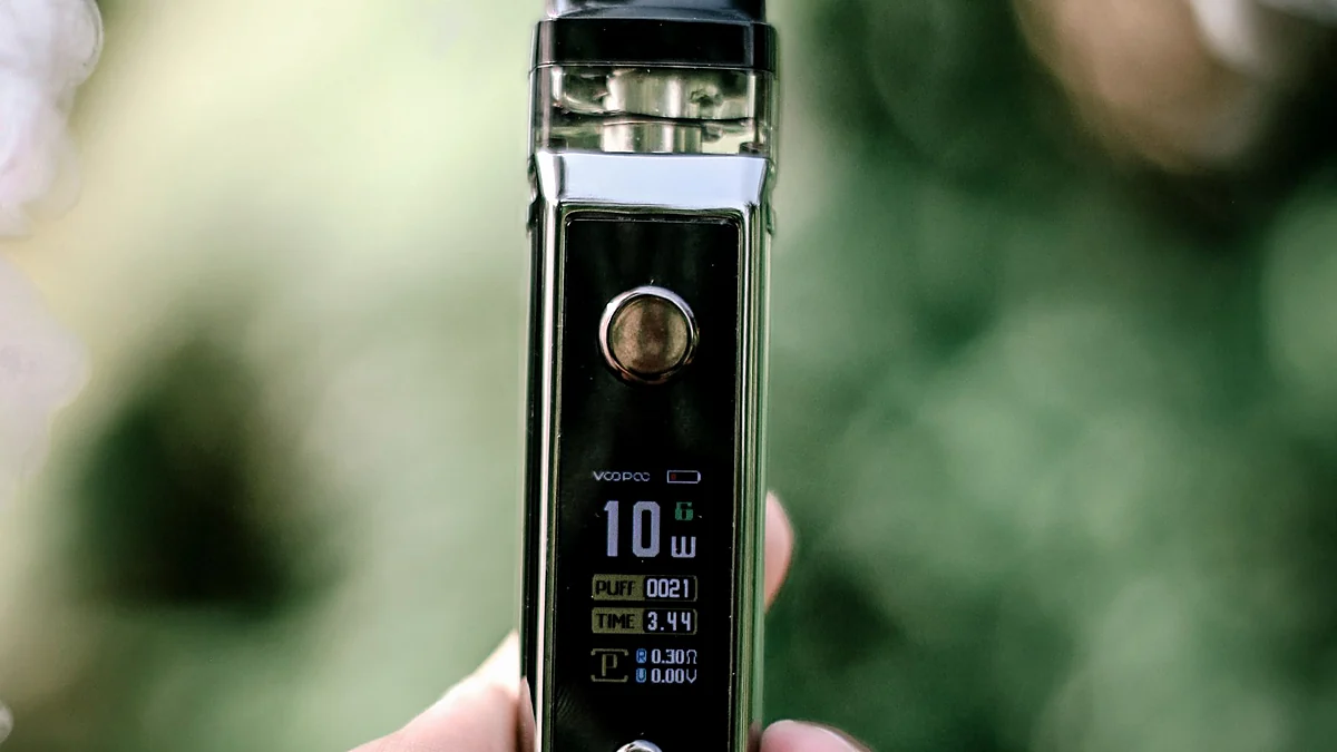 Close view of a vaping device and smoke representing nicotine exposure